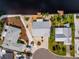 An aerial view of the house with a waterfront and meticulously landscaped yard at 805 Leisey Cir, Ruskin, FL 33570