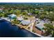 Gorgeous waterfront home boasts a private dock, palm trees and serene canal views in a desirable location at 805 Leisey Cir, Ruskin, FL 33570