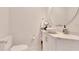Bathroom with granite countertop, white cabinetry, modern faucet, and vessel sink at 805 Leisey Cir, Ruskin, FL 33570