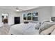 Comfortable bedroom features stylish accents, hard wood floors, and a large window at 805 Leisey Cir, Ruskin, FL 33570