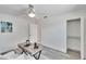 Bedroom featuring a modern desk, ceiling fan, and a closet with shelving at 805 Leisey Cir, Ruskin, FL 33570