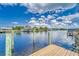 Private dock access to the tranquil waters, offering stunning views and endless opportunities for boating and recreation at 805 Leisey Cir, Ruskin, FL 33570