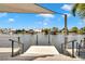 Dock and waterfront featuring stairs leading to boat dock and views of tropical neighborhood across the canal at 805 Leisey Cir, Ruskin, FL 33570
