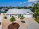 An aerial view of the house with a well-manicured lawn and a two-car garage at 805 Leisey Cir, Ruskin, FL 33570
