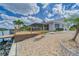 A waterfront home with a spacious deck and a beautiful landscaped yard at 805 Leisey Cir, Ruskin, FL 33570