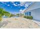 Features a beautifully landscaped yard, a waterfront view, and stepping stone pavers at 805 Leisey Cir, Ruskin, FL 33570