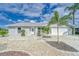 Charming single-story home with well-manicured landscaping and a paved driveway at 805 Leisey Cir, Ruskin, FL 33570