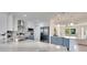 Bright kitchen featuring stainless steel appliances, a marble countertop island, and modern cabinetry at 805 Leisey Cir, Ruskin, FL 33570