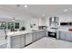 Updated kitchen featuring stainless steel appliances, marble countertops, and ample cabinet space at 805 Leisey Cir, Ruskin, FL 33570