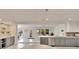 Open-concept kitchen with view to dining and living areas with access to the outdoors at 805 Leisey Cir, Ruskin, FL 33570