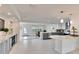 Open kitchen and dining area with a view of the patio through the glass door at 805 Leisey Cir, Ruskin, FL 33570