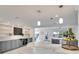 Open kitchen with a breakfast bar, stainless steel appliances, and a view to the backyard at 805 Leisey Cir, Ruskin, FL 33570