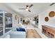 Open living space with sliding doors to patio, comfortable seating, and views into the kitchen and dining areas at 805 Leisey Cir, Ruskin, FL 33570
