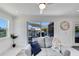 Bright living room featuring modern decor, water views, and access to outdoor patio at 805 Leisey Cir, Ruskin, FL 33570