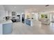 Open-concept living space featuring a kitchen, dining, and living area with views at 805 Leisey Cir, Ruskin, FL 33570