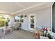 Covered porch offers seating area and direct access to waterfront views at 805 Leisey Cir, Ruskin, FL 33570