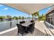 Waterfront porch with dining table, shade cover and scenic water views at 805 Leisey Cir, Ruskin, FL 33570