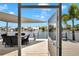 Covered and screened lanai looking out to waterfront with boats and docks at 805 Leisey Cir, Ruskin, FL 33570
