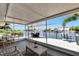 Spacious covered porch with comfortable seating and panoramic water views at 805 Leisey Cir, Ruskin, FL 33570