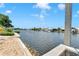 Scenic waterfront view from the property, showcasing the tranquil waters and neighborhood of canals and docks at 805 Leisey Cir, Ruskin, FL 33570