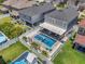 Aerial view of a home showcasing a backyard with pool, spa, patio, and fenced-in yard at 8148 Artisan Cir, Seminole, FL 33777