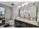 Elegant bathroom with dual sinks, granite countertops, and stylish fixtures for a luxurious experience at 8148 Artisan Cir, Seminole, FL 33777
