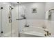 Bright bathroom features a soaking tub, separate shower, and modern finishes, creating a spa-like atmosphere at 8148 Artisan Cir, Seminole, FL 33777