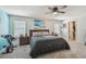 Bright, airy bedroom with modern decor, large windows, and easy access to a walk-in closet at 8148 Artisan Cir, Seminole, FL 33777