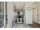 Inviting entryway featuring neutral walls, hardwood floors, and charming decor at 8148 Artisan Cir, Seminole, FL 33777