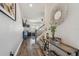 Stylish entryway featuring wood floors, modern decor, and access to the living spaces at 8148 Artisan Cir, Seminole, FL 33777