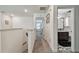 Upstairs hallway features neutral walls, plush carpet, and easy access to bedrooms and bathroom at 8148 Artisan Cir, Seminole, FL 33777