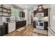 The kitchen boasts dark cabinets, stainless steel appliances, granite counters, subway tile, and modern fixtures at 8148 Artisan Cir, Seminole, FL 33777