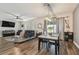 This living space is bathed in natural light and integrates the dining and living areas at 8148 Artisan Cir, Seminole, FL 33777