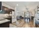 A contemporary design with open spaces featuring kitchen, dining, and living area bathed in natural light at 8148 Artisan Cir, Seminole, FL 33777
