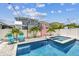 Sparkling pool and integrated spa with paver deck, palms, and privacy fence create a backyard oasis at 8148 Artisan Cir, Seminole, FL 33777