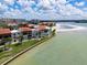 Stunning waterfront property with lush landscaping, sandy beach, and clear views of the beautiful ocean at 825 S Gulfview Blvd # 104, Clearwater Beach, FL 33767