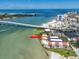 Waterfront condo complex with beach access near bridge to a city, view from above at 825 S Gulfview Blvd # 104, Clearwater Beach, FL 33767