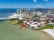 Expansive aerial view of waterfront condos with access to a sandy beach and views of the Gulf of Mexico at 825 S Gulfview Blvd # 104, Clearwater Beach, FL 33767