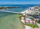 Waterfront condo complex with beach access, tennis courts, and city views near a large bridge at 825 S Gulfview Blvd # 104, Clearwater Beach, FL 33767