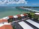 View from above of condo complex with waterfront access and covered parking at 825 S Gulfview Blvd # 104, Clearwater Beach, FL 33767