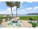 Gorgeous backyard featuring brick pavers, beautiful plants and lawn, with stunning views of the ocean at 825 S Gulfview Blvd # 104, Clearwater Beach, FL 33767