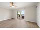Bedroom featuring a sliding glass door to a patio and water view, wood flooring, and closet at 825 S Gulfview Blvd # 104, Clearwater Beach, FL 33767