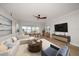 Spacious living room open to dining room with ample seating and a stunning view of the outdoors at 825 S Gulfview Blvd # 104, Clearwater Beach, FL 33767
