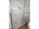 Close-up of walk-in shower with glass door and mosaic tile at 825 S Gulfview Blvd # 104, Clearwater Beach, FL 33767