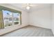 Bedroom featuring plush carpeting and a large window providing plenty of natural light at 8319 Annwood Rd, Seminole, FL 33777
