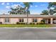 Charming single-story home with well-maintained landscaping, large windows, and covered parking at 8319 Annwood Rd, Seminole, FL 33777