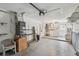 Spacious garage featuring shelving and laundry area with washer and dryer hookups at 8319 Annwood Rd, Seminole, FL 33777