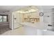 Open kitchen featuring white cabinets and modern appliances at 8319 Annwood Rd, Seminole, FL 33777