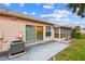 Patio area with sliding glass doors leading into the home, and view of enclosed porch at 8319 Annwood Rd, Seminole, FL 33777