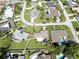 Aerial view of a neighborhood featuring manicured lawns, mature trees, and well-kept homes at 8671 11Th N St, St Petersburg, FL 33702